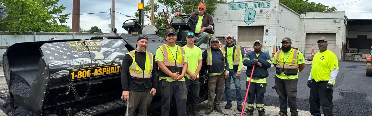 Professional asphalt paving crew working on a commercial lot in Cleveland, OH