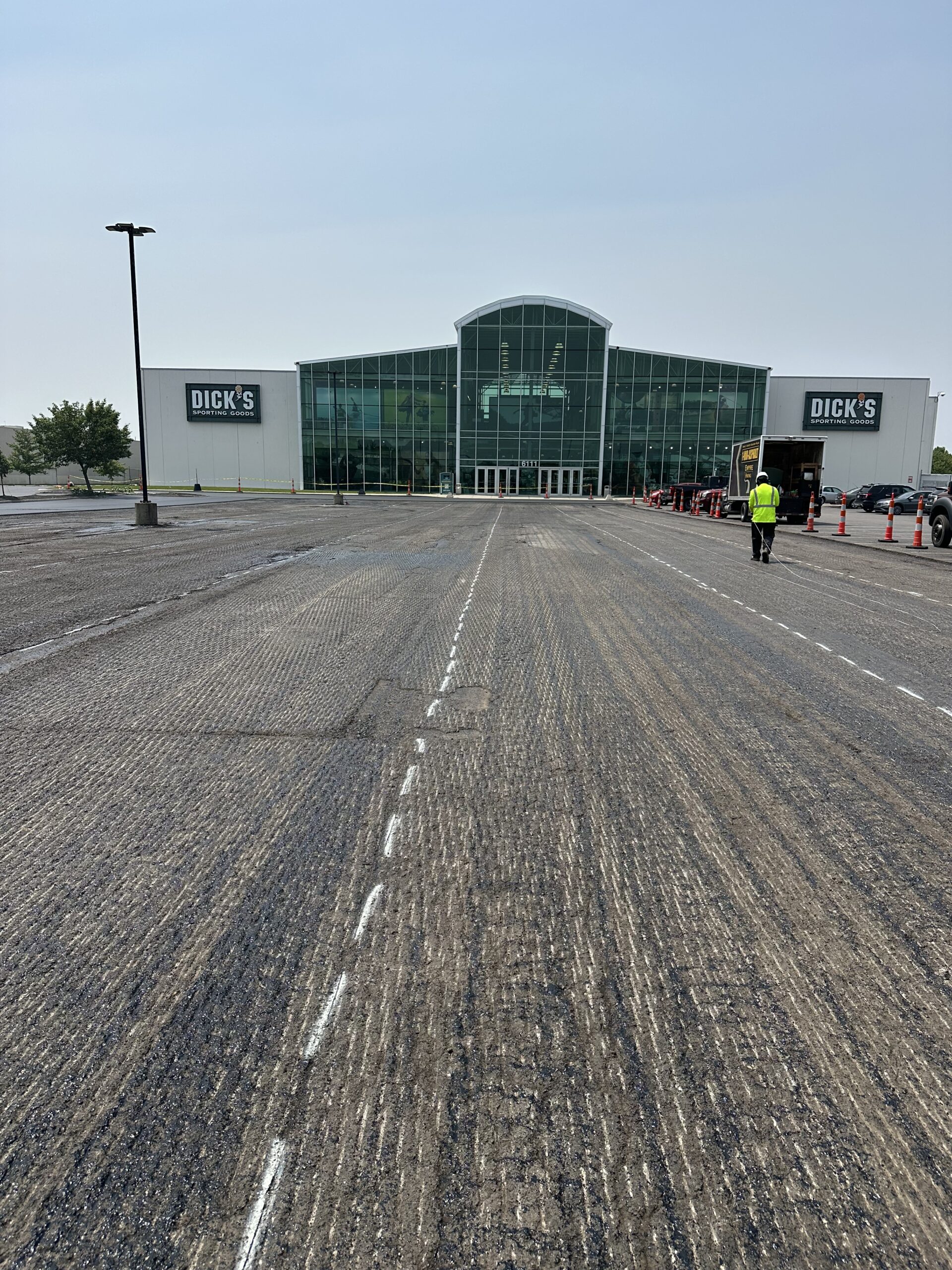 Empire Paving crew performing asphalt milling on a commercial parking lot in Northeast Ohio