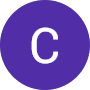 A purple circle with a white, uppercase letter C centered inside. The background is light gray.